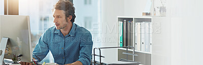 Buy stock photo Computer, typing and web development with business man at desk in office for planning or research. Banner, mockup and space with confident employee in workplace for online review of information
