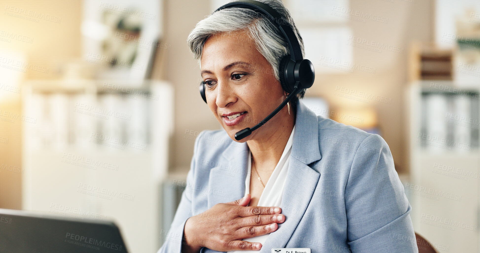 Buy stock photo Woman, headset and doctor at tech for healthcare, online consultation or video call in office. Mature specialist, computer or communication in practice for patient feedback, explain symptoms and help