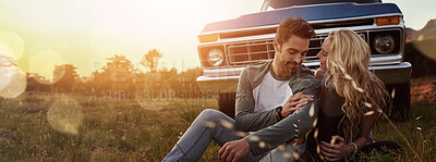 Buy stock photo Relax, nature and couple by car for travel by sunset on vacation, weekend or holiday. Happy, love and young man and woman outdoor in field by vehicle for road trip getaway together in evening.