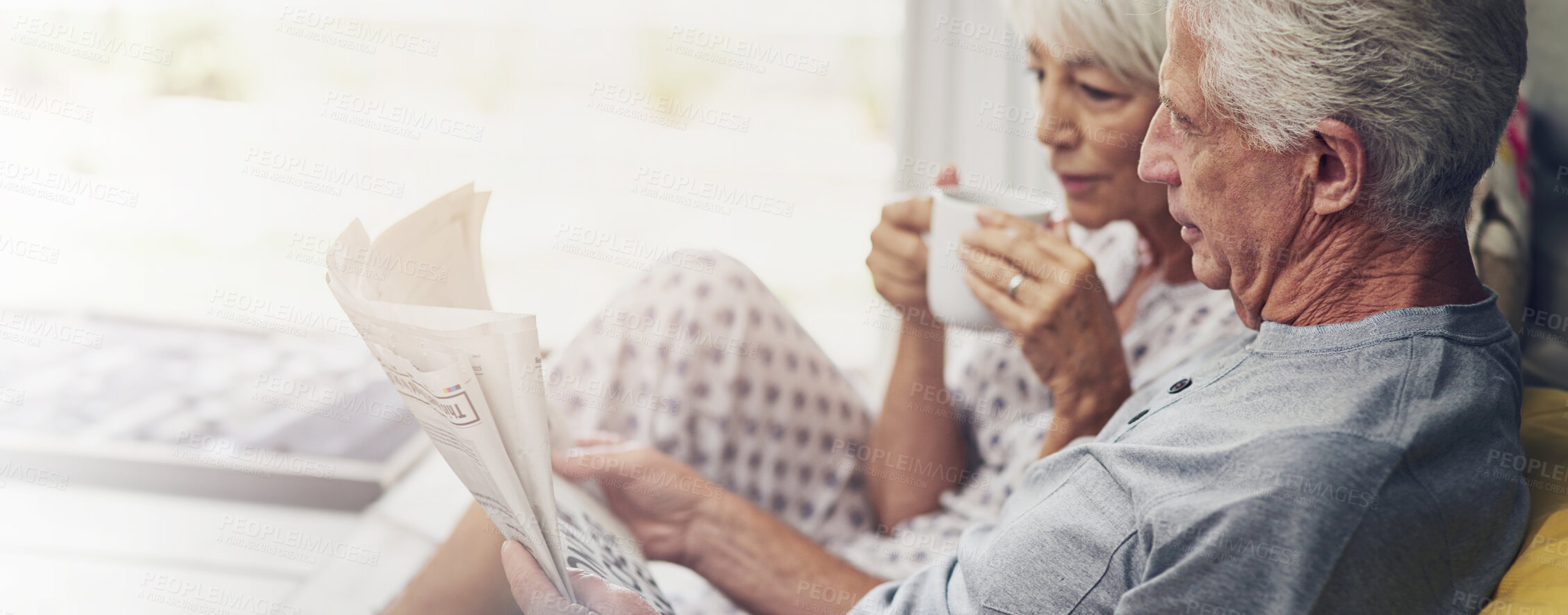 Buy stock photo Bedroom, home and senior couple with newspaper, marriage and reading with comfort. Pensioner, apartment and old man with elderly woman, conversation and relationship with information, talk or article