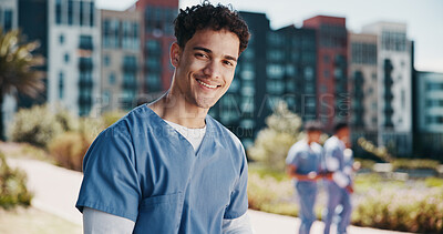 Buy stock photo Man, outdoor and portrait as medical student for career, learning and education in clinic. Male person, smile and confidence for development, healthcare and studying in university campus or hospital