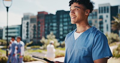 Buy stock photo Outdoor, man and nurse with tablet, thinking and healthcare with happiness, uniform and website info. People, medical and professional with tech, online results and report with confidence or pride