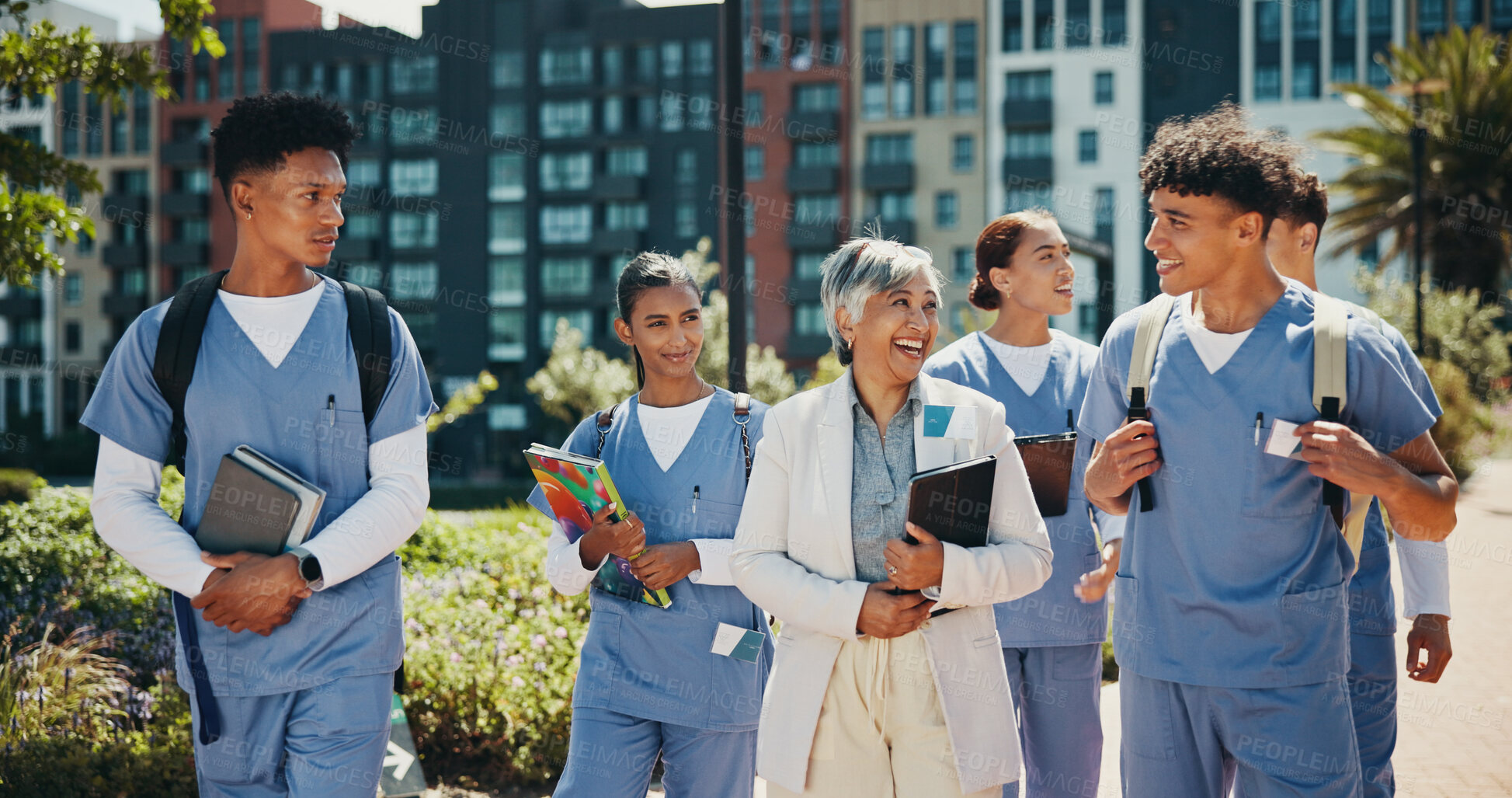 Buy stock photo Medical student, walking and professor with people in outdoor for college, healthcare and teacher. Scholarship, internship and doctors with students on hospital campus for assignment and education