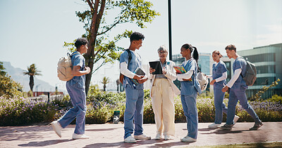 Buy stock photo Medical student, internship and professor with people in outdoor for college, healthcare and teacher. Scholarship, university and doctors with students on hospital campus for assignment and education