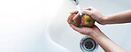 Hands, faucet and washing apples in home for hygiene, dirt or toxic pesticide for safety by kitchen sink. Person, fruits and water for cleaning dust, germs or mockup space for gut health at apartment