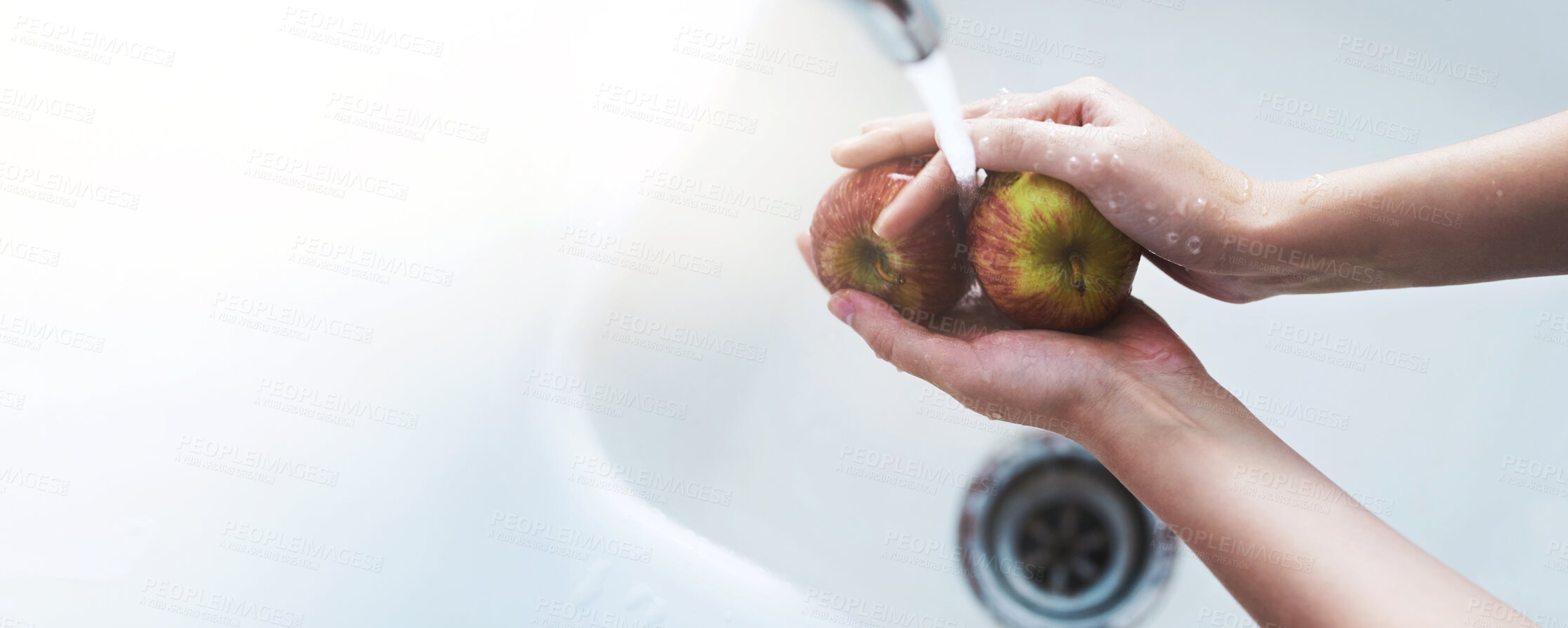 Buy stock photo Hands, faucet and washing apples in home for hygiene, dirt or toxic pesticide with banner for safety by sink. Person, fruits and water for cleaning dust, germs or mockup space for snack at apartment