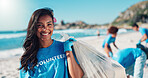 Volunteer, beach and portrait of woman with bag for cleaning dirt, plastic and litter for ocean pollution. Community service, charity and person for environmental care, recycling and climate change