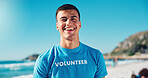Volunteer, charity and portrait of man on beach for cleaning dirt, plastic and litter for ocean pollution. Community service, happy and person for environmental care, recycling and climate change