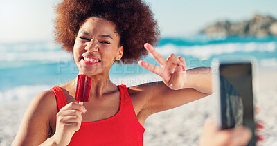 Buy stock photo Girl, beach and ice cream with phone for photo, peace sign and summer with emoji for post on web. African woman, smile and popsicle with v icon, symbol and vacation with social network in Nigeria