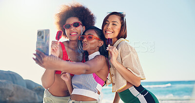 Buy stock photo Friends, selfie and women with popsicle at beach, summer or holiday with diversity with mobile app. Girl, happy and hug in group for photography, profile picture or social media with treat by sea