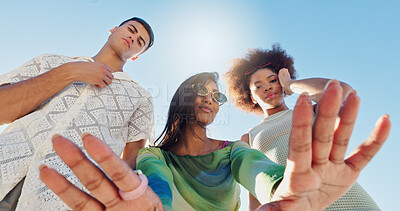 Buy stock photo Friends, selfie and gen z people in low angle, blue sky or fashion with attitude for portrait in sunshine. Woman, group and hands for photography, memory or profile picture with streetwear in summer