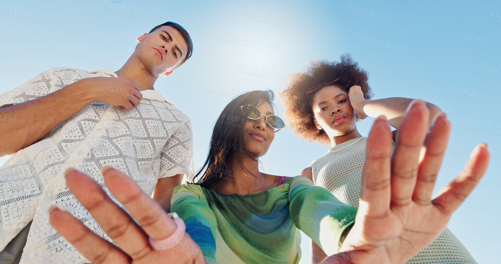 Buy stock photo Friends, selfie and gen z people in low angle, blue sky or fashion with attitude for portrait in sunshine. Woman, group and hands for photography, memory or profile picture with streetwear in summer