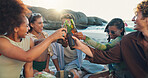 Beach, cheers and group of people with beer, smile and bonding on tropical holiday together. Friends, men and women relax at ocean with drinks, fun outdoor vacation and happy celebration in nature