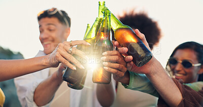 Buy stock photo Beach, cheers and group of happy people with beer, sunset and bonding on tropical holiday together. Friends, men and women toast at ocean with drinks, outdoor vacation and fun celebration in nature