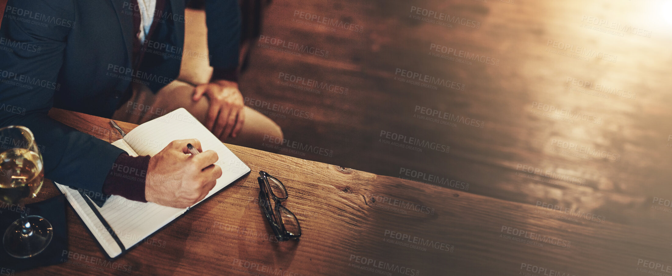 Buy stock photo Business, writing and hands of man with notes, wine and schedule plan in journal for inspiration on banner. Above, notebook and writer with ideas for growth proposal, agenda or reminder on bar space