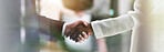 Handshake, banner and hands of business people in office for teamwork, collaboration and partnership. Corporate, professional and workers with deal gesture for agreement, b2b networking or thank you