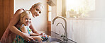 Kitchen, mother and happy with girl washing dishes on portrait for bonding and support at home. Apartment, banner and parent with kid for hygiene with teaching or help for child development
