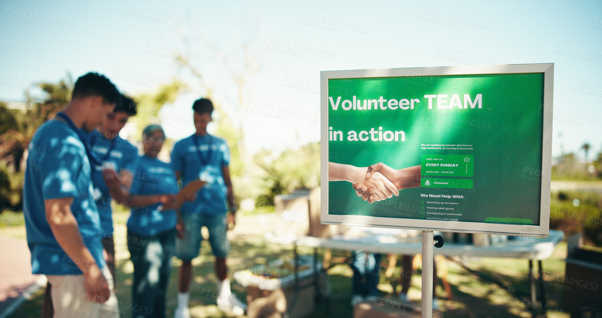 Buy stock photo Volunteer, team and billboard with poster for community service, charity or non profit organization at park. People, group or advertising with donations for poor society, humanity or food supplies