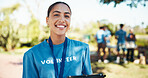 Woman, happy and portrait of volunteer in nature with community service, NGO or donation project. Smile, confident and female charity worker with confidence outdoor in field for social activism.