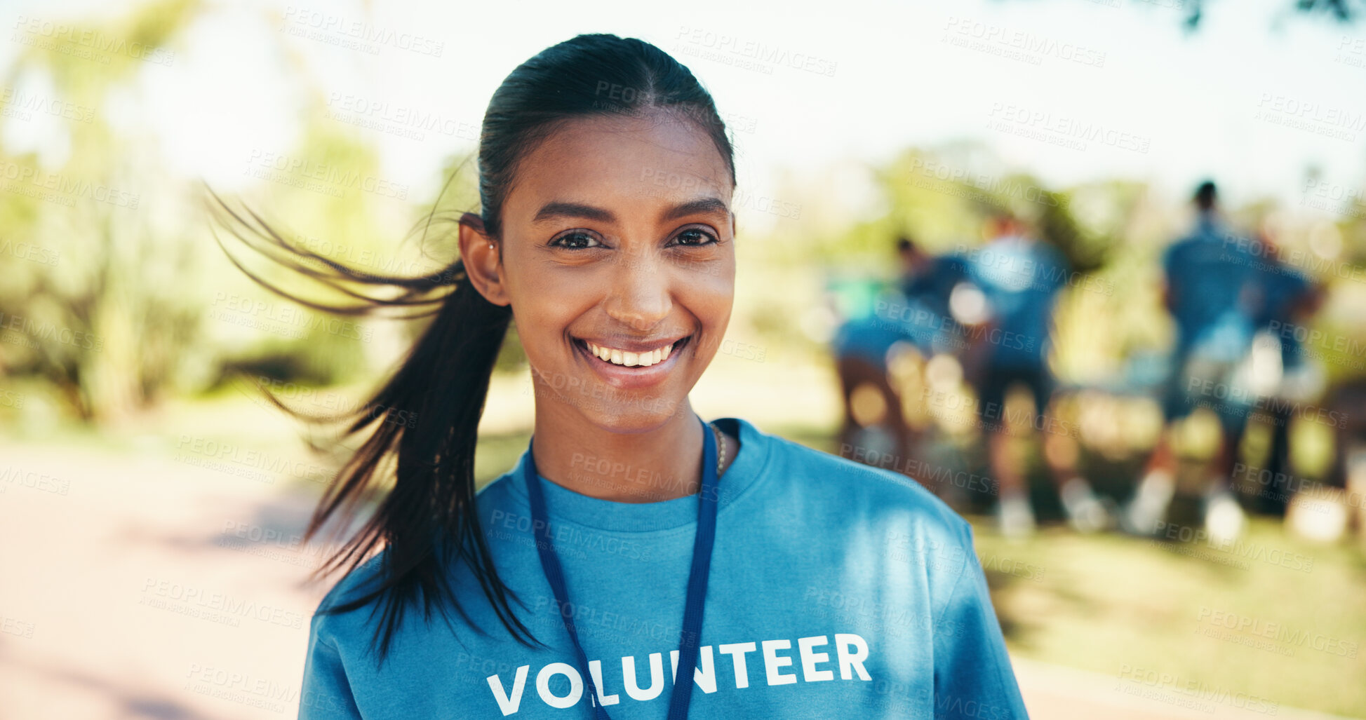 Buy stock photo Charity, portrait and wind with woman volunteer outdoor in park for community food drive or donation. Activism, smile and society development with happy person as welfare worker for NGO or non profit