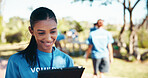 Charity, smile and tablet with woman volunteer outdoor in park for community food drive or donation. Activism, checklist and schedule with happy person as welfare worker for NGO or non profit