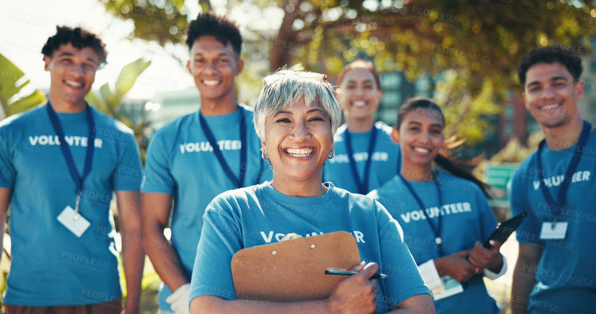 Buy stock photo Charity, leadership and portrait of volunteer team outdoor in park for community food drive or donation. Activism, clipboard and smile with group of people as welfare workers for NGO or non profit