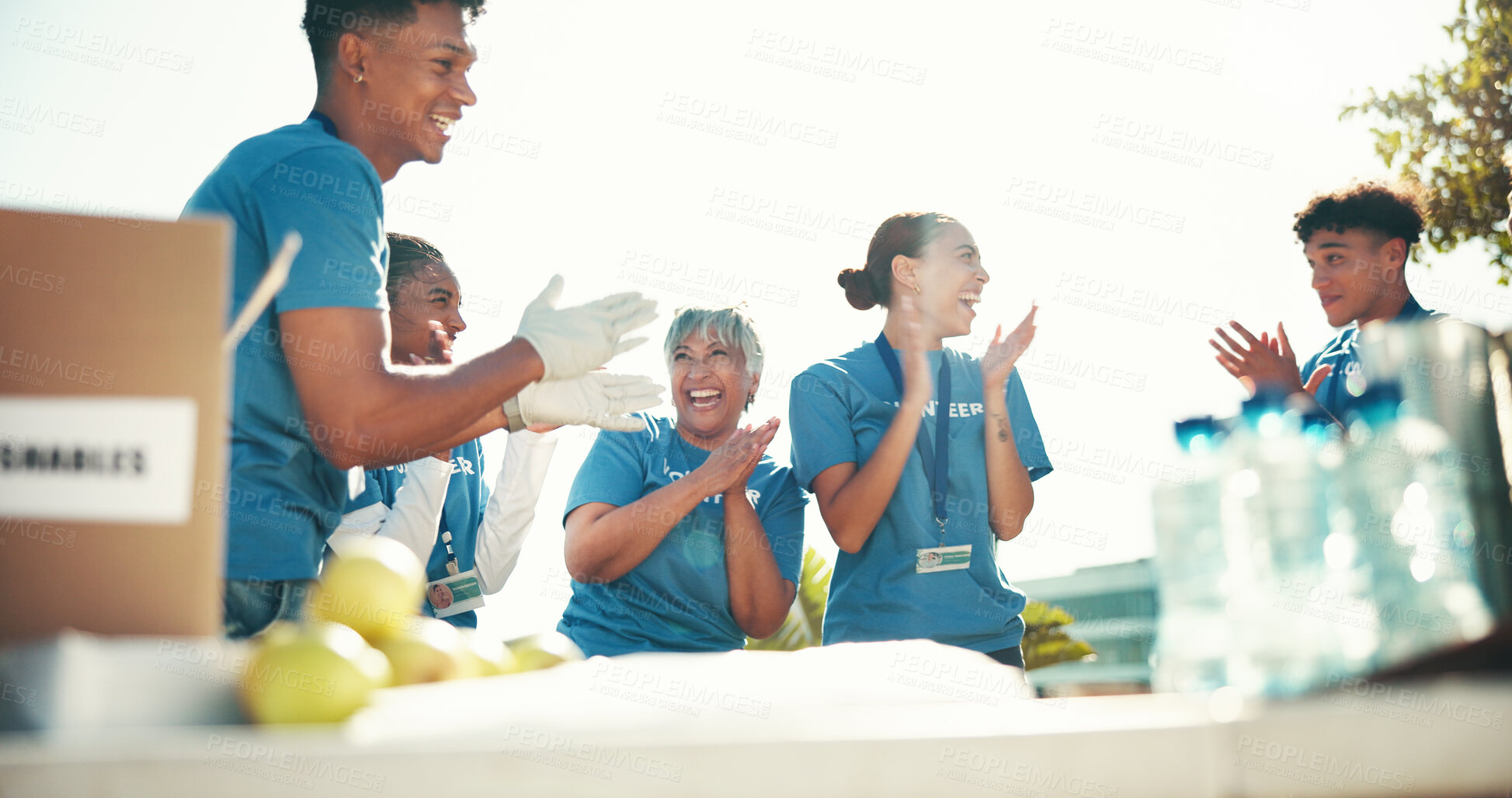 Buy stock photo Clapping, volunteers and success for charity, group and celebration for fundraiser, team or mature woman. Outdoor, coordinator and achievement for community service, people or applause for food drive