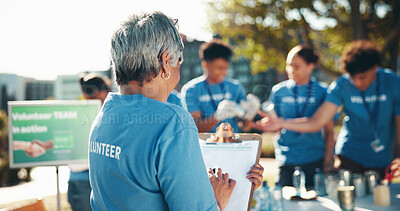 Buy stock photo Checklist, volunteer and program as group for community service, project or nonprofit initiative. Female person, clipboard and notes for sustainability, outdoor or charity with help, donations or NGO