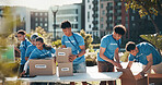 Nature, people and group of volunteers with help, goals and donations at charity event in park. Non profit, boxes and NGO people outdoor in field for community service project in collaboration.