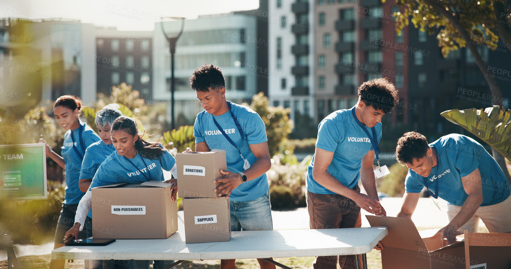 Buy stock photo Nature, people and group of volunteers with help, goals and donations at charity event in park. Non profit, boxes and NGO startup outdoor in field for community service project in collaboration.