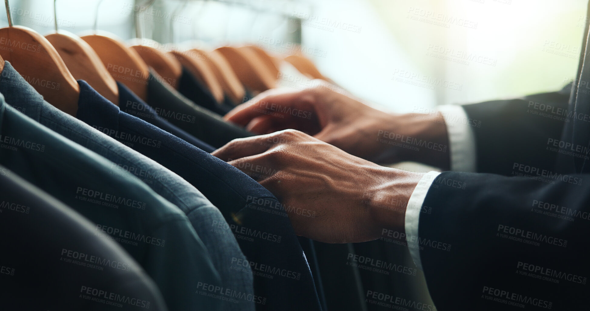 Buy stock photo Hands, businessman and decision for clothes shopping with blazer check, fabric quality and customer experience. Person, rack and choice for professional collection, suit wardrobe and fashion industry