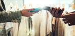 Shopping, card machine and customer with phone for payment in store for bargain, sale and purchase. Retail, fashion and hands of person in boutique, mall and market for products, clothing and POS