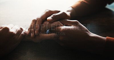 Buy stock photo Couple, holding hands and love on table at house with compassion, partnership and consoling of depression. People, support and comfort with relationship crisis, partner empathy and loyalty connection