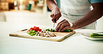 Hands, cook and healthy food in kitchen for cooking, meal prep and cutting as recipe for nutrition. Person, chopping board and culinary arts with vegetables, ingredients and apron for cuisine in home