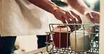 Hands, cleaner and cleaning dishes at house with dishwasher, dirty utensils and loading machine of hygiene. Person, technology and crockery for household chore, disinfectant routine and domestic task