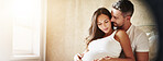 Love, pregnancy and couple by window in home with relax, bonding and marriage commitment to family. Rest, maternity leave and man embracing pregnant woman for prenatal care connection in apartment.