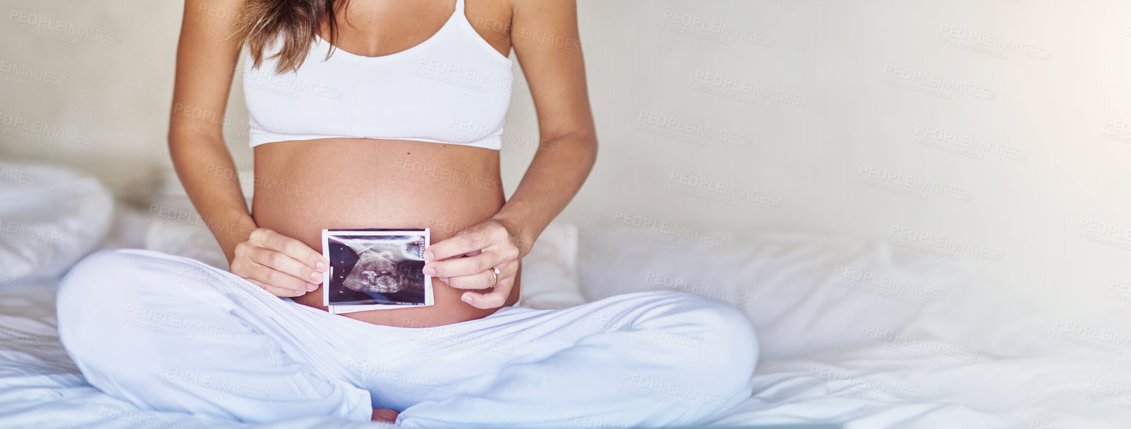 Buy stock photo Ultrasound, banner and stomach of pregnant woman in bedroom for scan, wellness and growth. Mockup space, baby development and pregnancy picture with closeup of person at home for sonogram photography