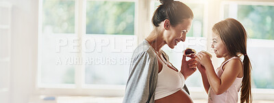 Buy stock photo Smile, eating and pregnant woman in kitchen with daughter for morning bonding together on banner space. Pregnancy, mom and girl child in home with breakfast cupcake, relax and happy family growth