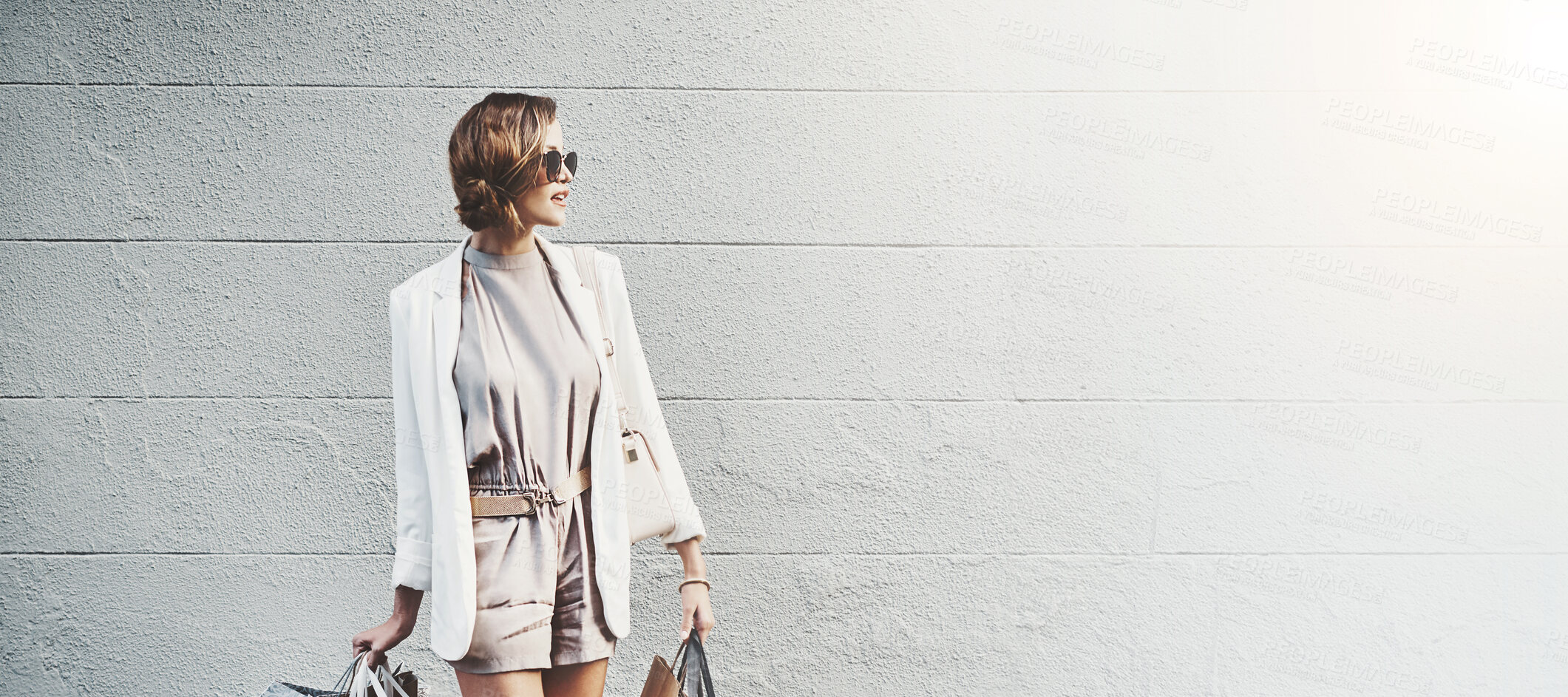 Buy stock photo Woman, shopping bag and travel for fashion in city, wall and mockup space for discount in street. Person, baggage and thinking with style, sale and retail deal with waiting for taxi on road in France