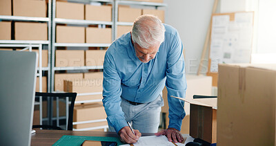 Buy stock photo Boxes, logistics and writing with business man in office for delivery or distribution planning. Desk, notebook and shipping with mature employee in workplace for management of supply chain schedule