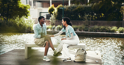 Buy stock photo People, students and campus for laughing on break, outdoor and friends talking on education. Women, academy and support with university project or module, funny conversation and study at college park