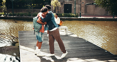 Buy stock photo People, students and campus for hug hello, outdoor and friends talking on education. Men, laughing and support with university project or module, conversation and study greeting at college park