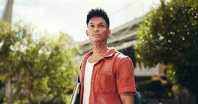 Buy stock photo Thinking, student and college with man in city for future, education and scholarship vision. Morning, reflection and university with person and books outdoor for gen z youth, memory and idea