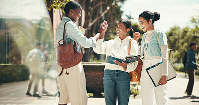 Buy stock photo Student, women and celebration with high five at college for application success, exam motivation and good news. Support, excited friends and books on campus for assignment research and achievement