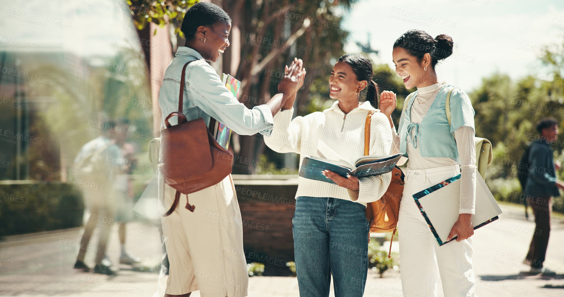 Buy stock photo Student, women and celebration with high five at college for application success, exam motivation and good news. Support, excited friends and books on campus for assignment research and achievement