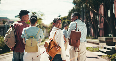 Buy stock photo Back, future and walking with student friends outdoor together for learning or study at university. College, education and portrait with happy learner group at school for knowledge or scholarship