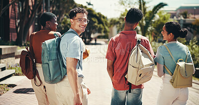 Buy stock photo Education, smile and walking with student friends outdoor together for learning or study at university. College, future and portrait with happy learner group at school for knowledge or scholarship