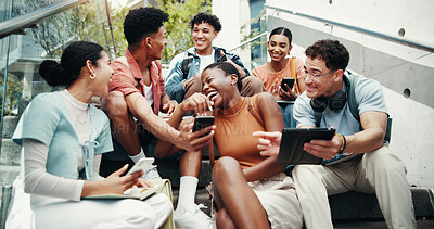 Buy stock photo Students, group and tech on stairs at college, laugh and share meme with diversity in low angle at campus. Friends, people and happy on steps with phone, tablet or streaming comic video at university