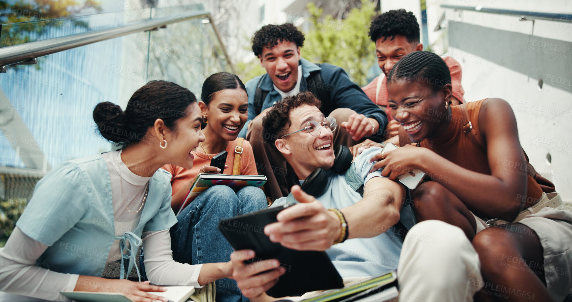 Buy stock photo Students, laughing and tech on stairs at campus, wow and share meme with diversity from low angle at university. Group, friends and happy on steps with phone, tablet or comic video on app at college