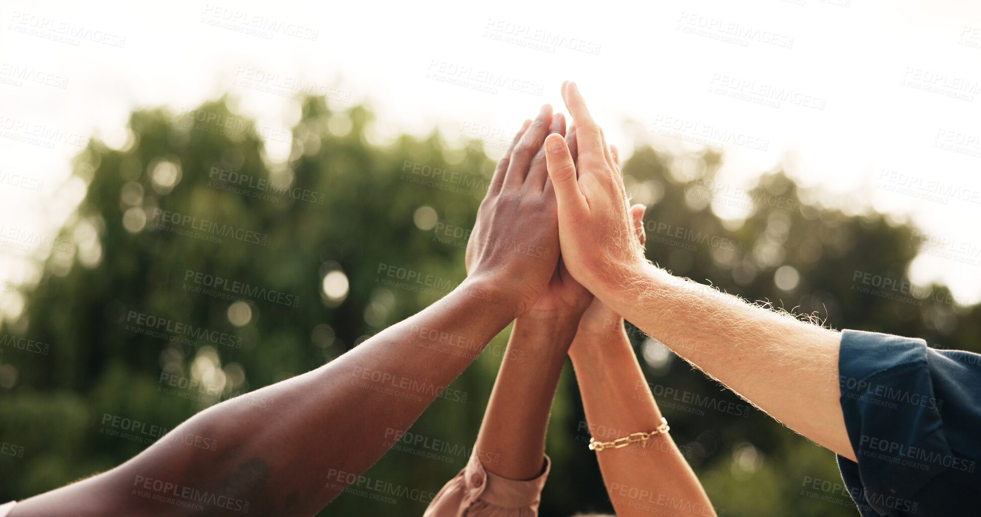 Buy stock photo People, hands and high five with team in unity for collaboration, mission or solidarity in nature. Group, huddle and circle with motivation or inclusion for support, trust or community together